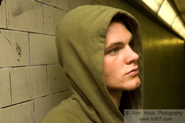 Young man in green hooded top